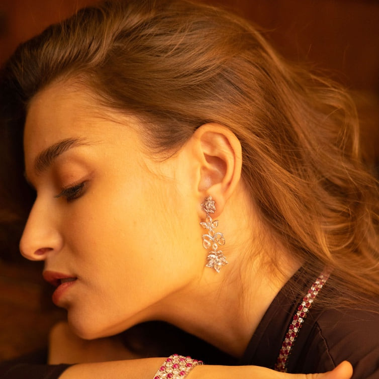 Client wearing Laurenti rose-cut diamond earrings in profile