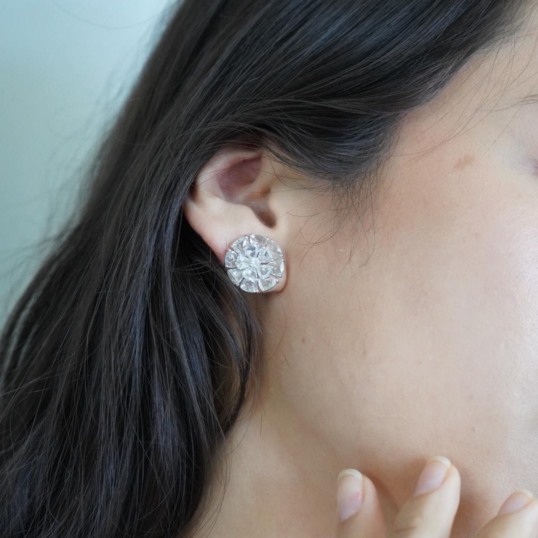 Natural diamond stud earrings worn by a model