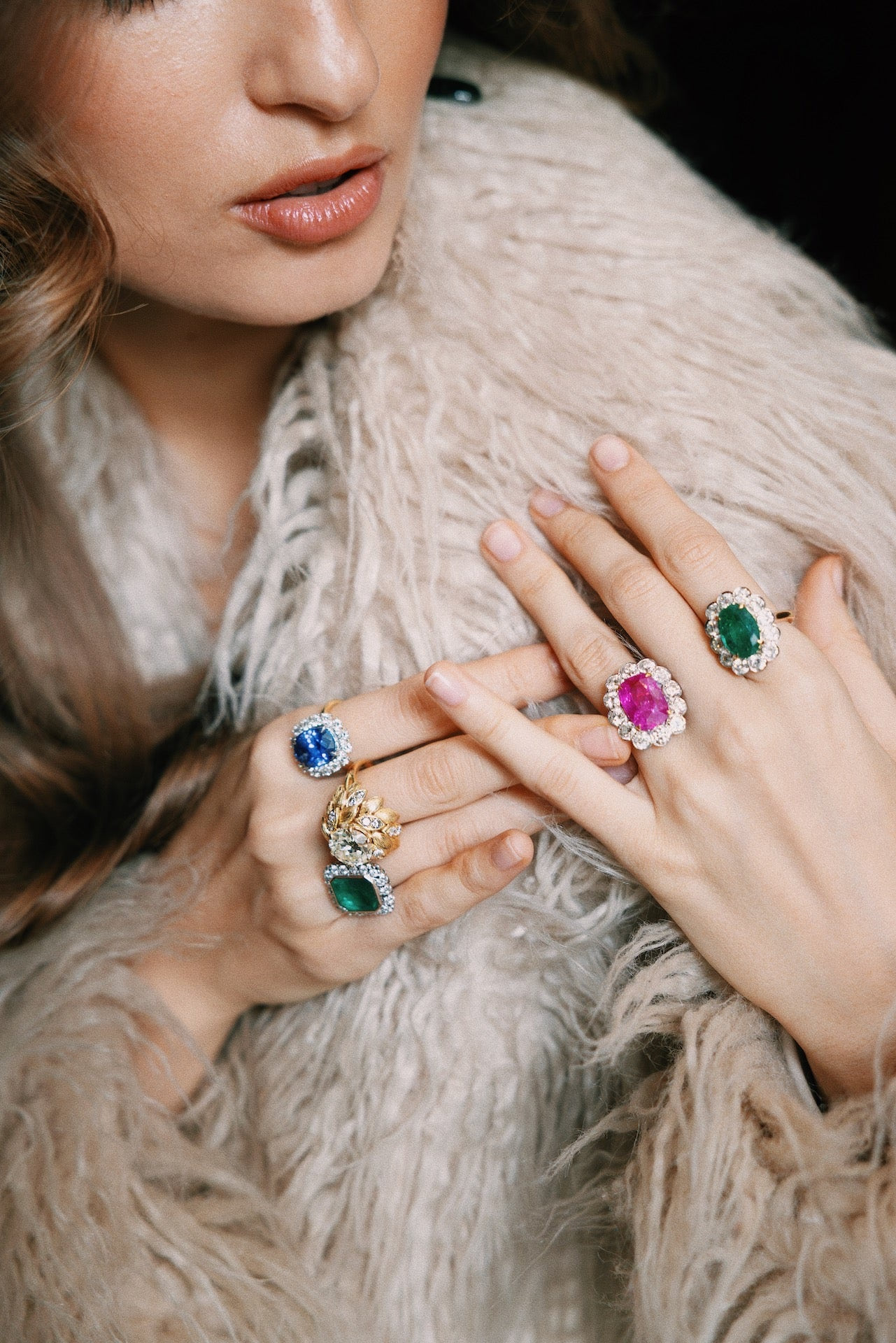 Laurenti one-of-one emerald, ruby and sapphire rings worn on the hand