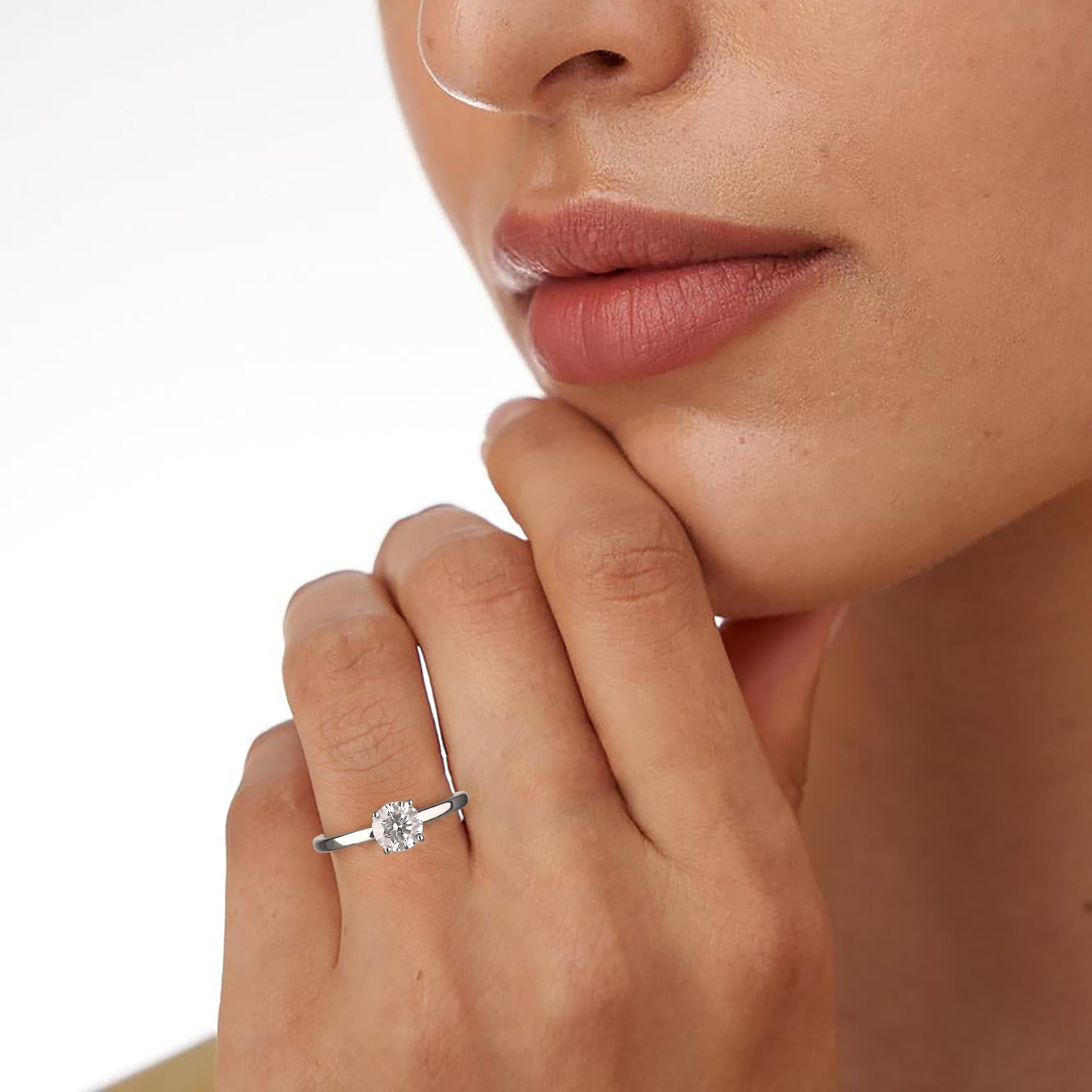 Model wearing a round natural diamond solitaire ring