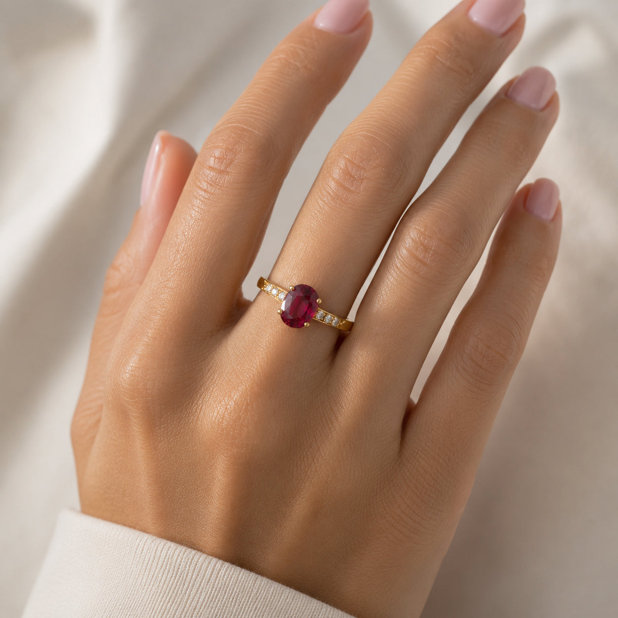Laurenti ruby and diamond ring worn on the hand