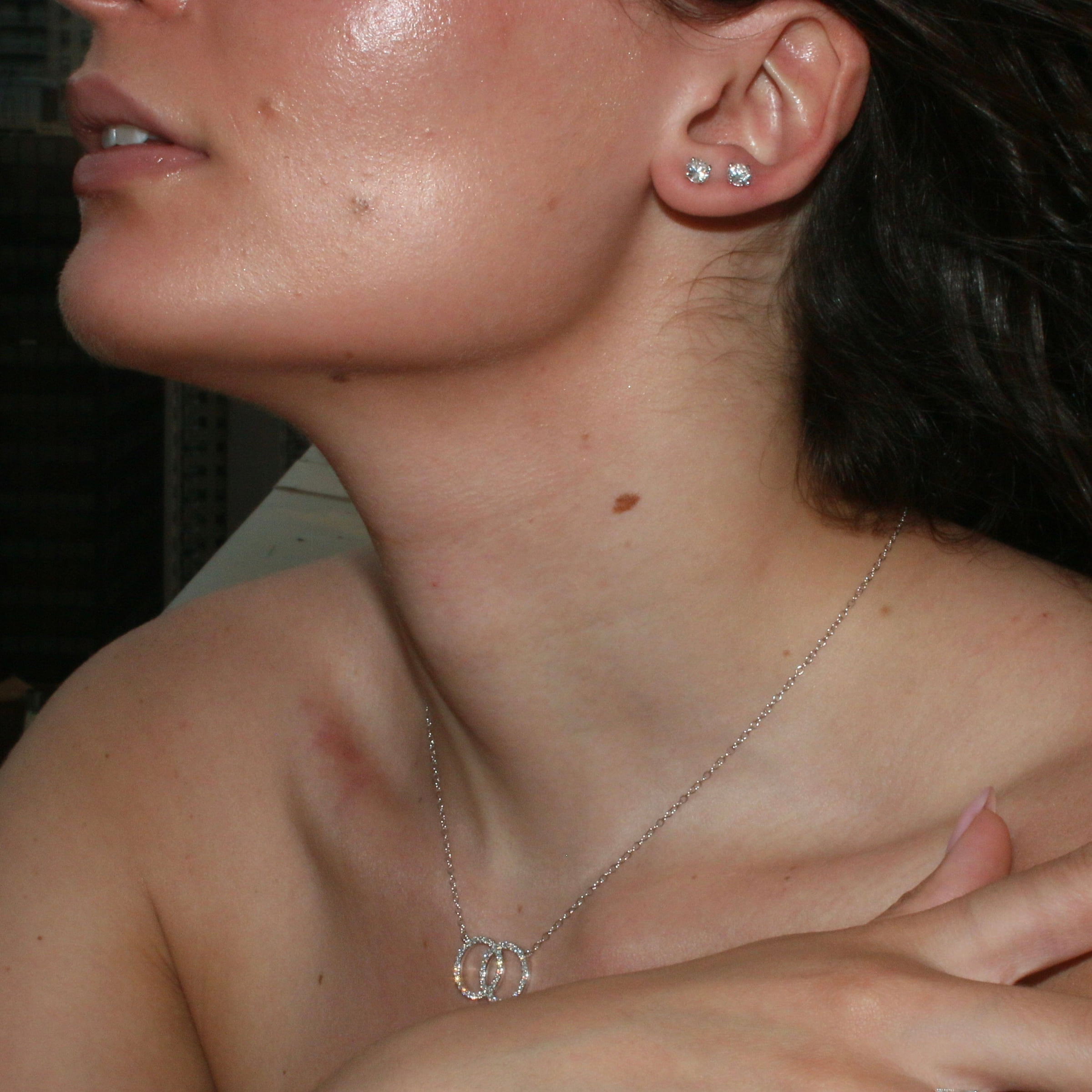 Natural diamond stud earrings worn by a model